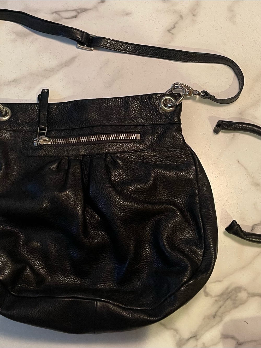 Roots Black Leather Crossbody with Front Zip and Silver Hardware